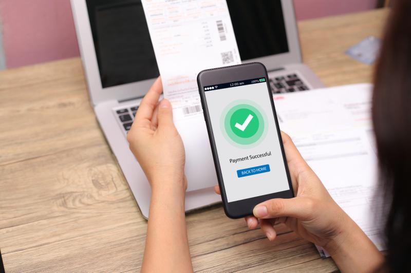 a cell phone with a green checkmark